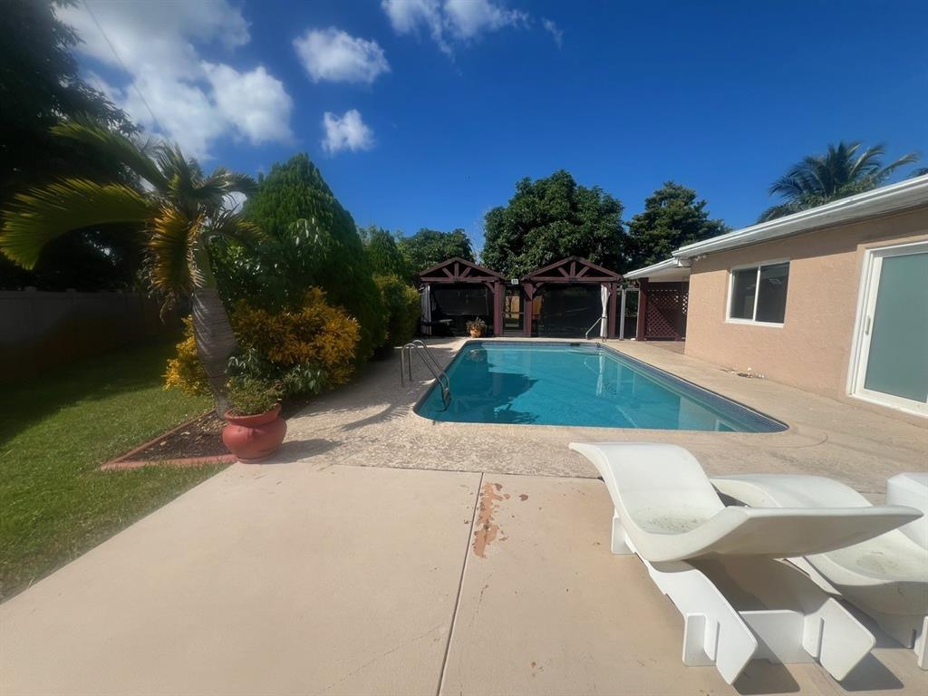 861 Southwest 55th Way Margate, FL 33068 - Photo 23 of 45 a view of back yard of the house