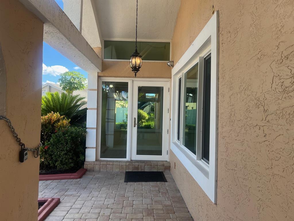 861 Southwest 55th Way Margate, FL 33068 - Photo 27 of 45 a front view of a house with a porch
