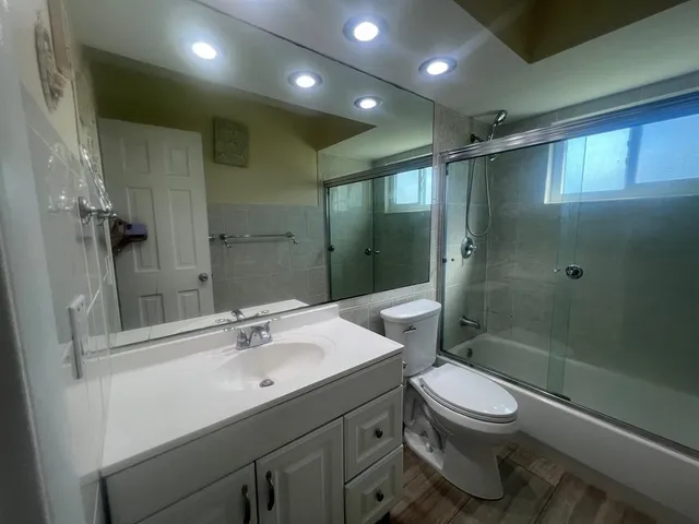 an outdoor sitting area with furniture