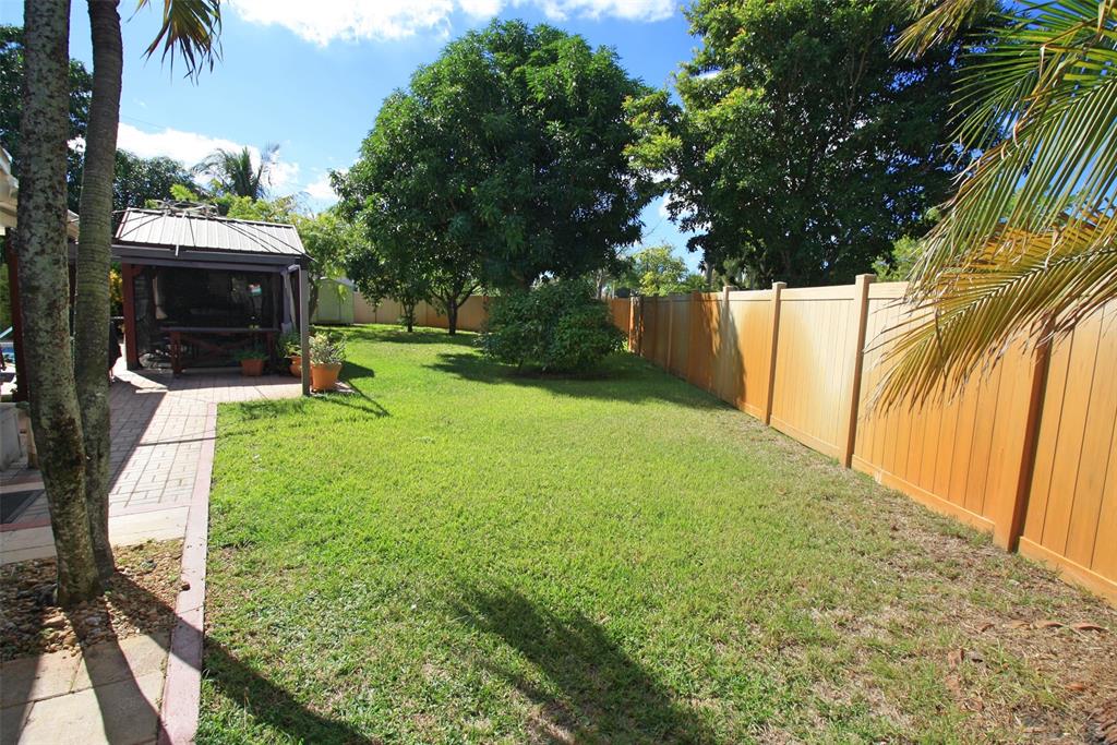 861 Southwest 55th Way Margate, FL 33068 - Photo 41 of 45 a view of a garden with a tree