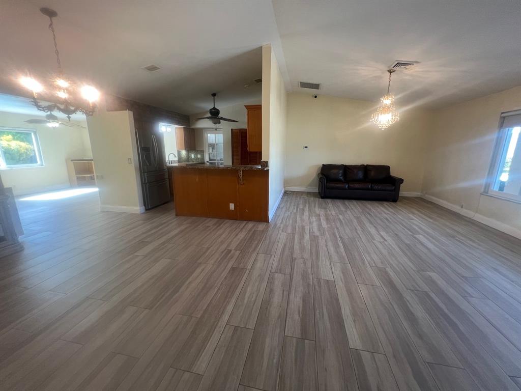 861 Southwest 55th Way Margate, FL 33068 - Photo 10 of 45 a view of a kitchen with a sink and a microwave
