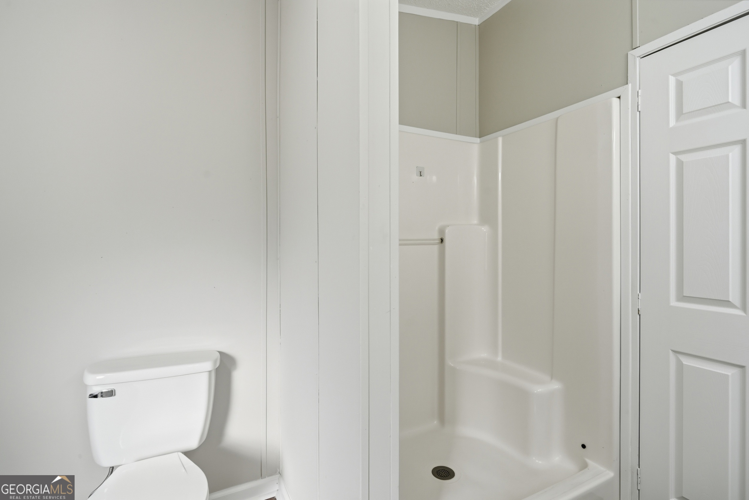 492 Doctortown Road Jesup, GA 31545 - Photo 15 of 25 a white toilet sitting next to a bathroom sink