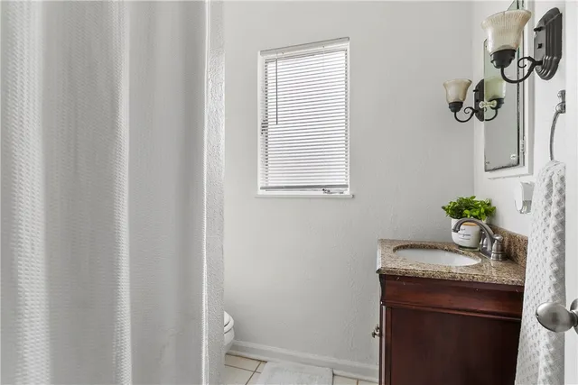 a room with a sink and a mirror