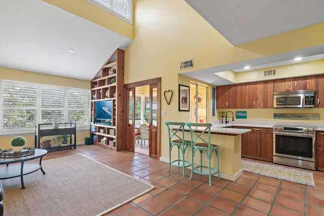 a kitchen with lots of counter top space and dining table