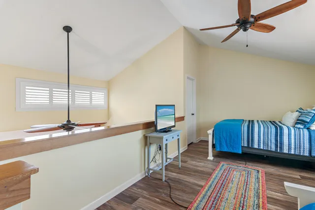 a kitchen with stainless steel appliances granite countertop a sink a stove and a wooden floors
