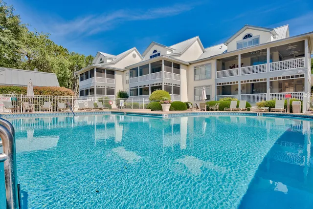 a view of a swimming pool with a lounge chairs