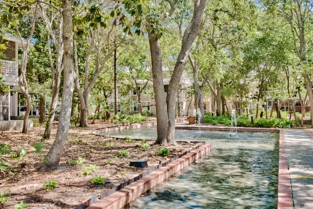 a view of yard with wooden fence