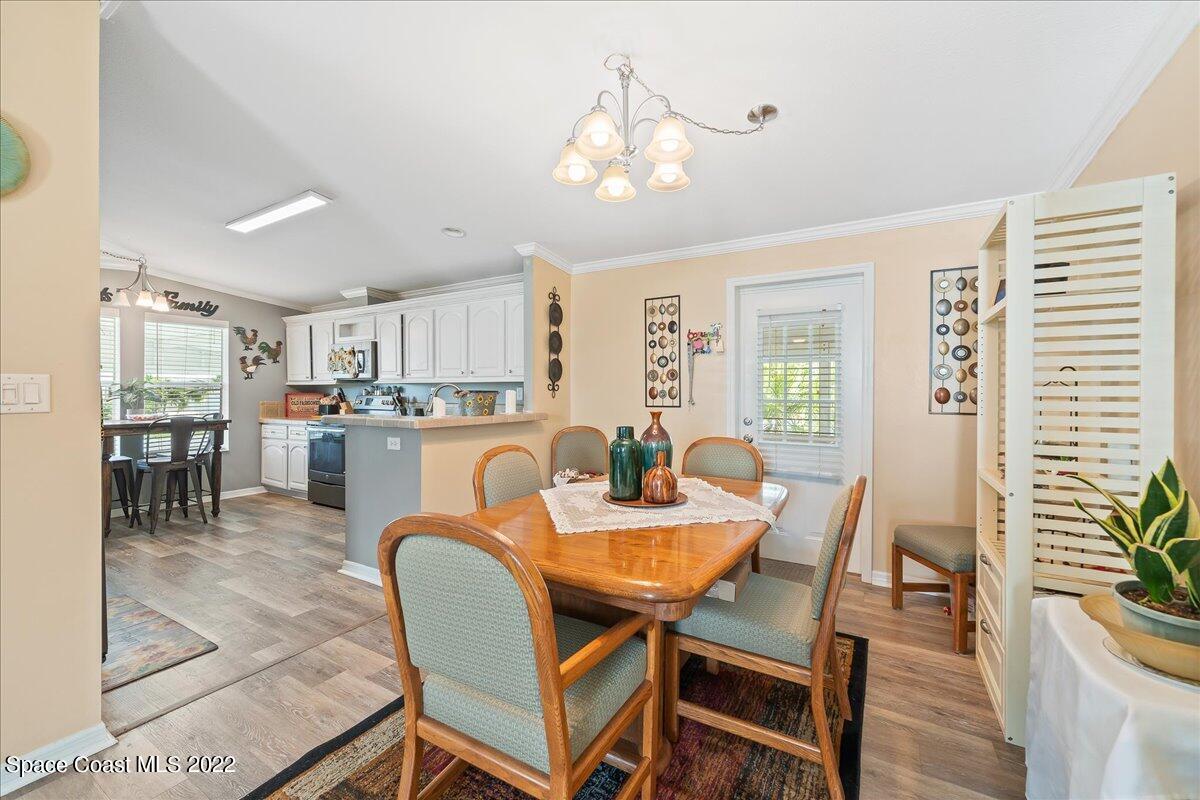 1017 Barefoot Circle Sebastian, FL 32976 - Photo 13 of 33 a dining room with furniture and window
