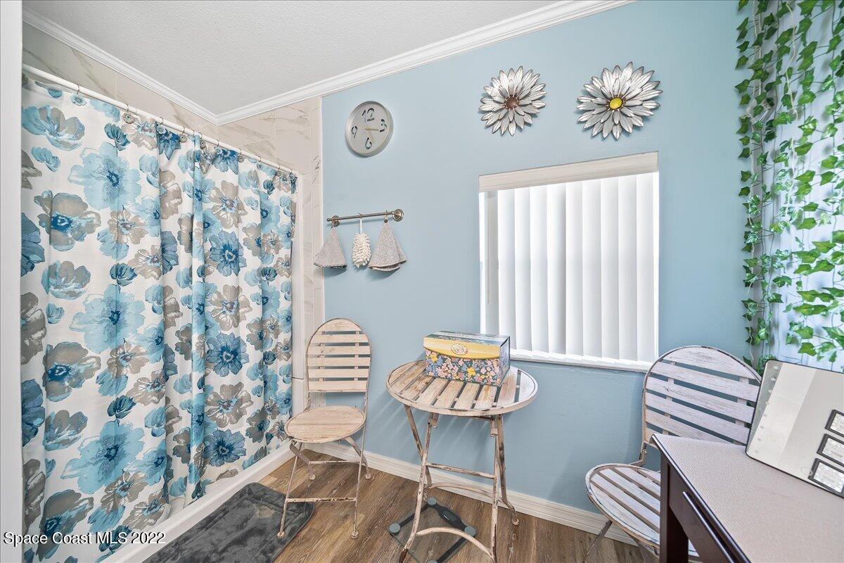 1017 Barefoot Circle Sebastian, FL 32976 - Photo 19 of 33 a living room with furniture and a window