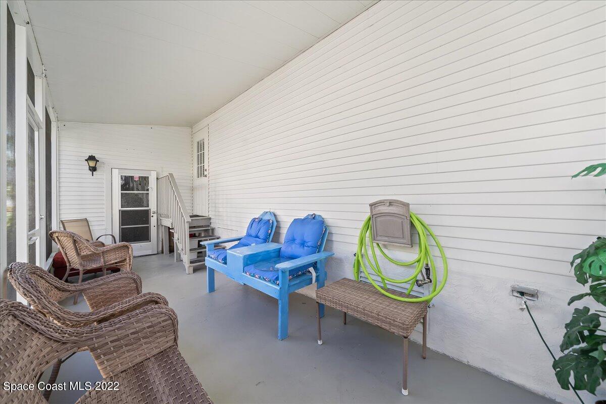 1017 Barefoot Circle Sebastian, FL 32976 - Photo 29 of 33 a living room with furniture and a window
