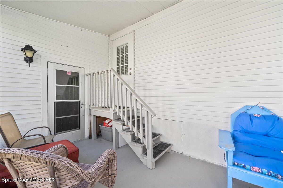 1017 Barefoot Circle Sebastian, FL 32976 - Photo 30 of 33 a bedroom with furniture and a chair