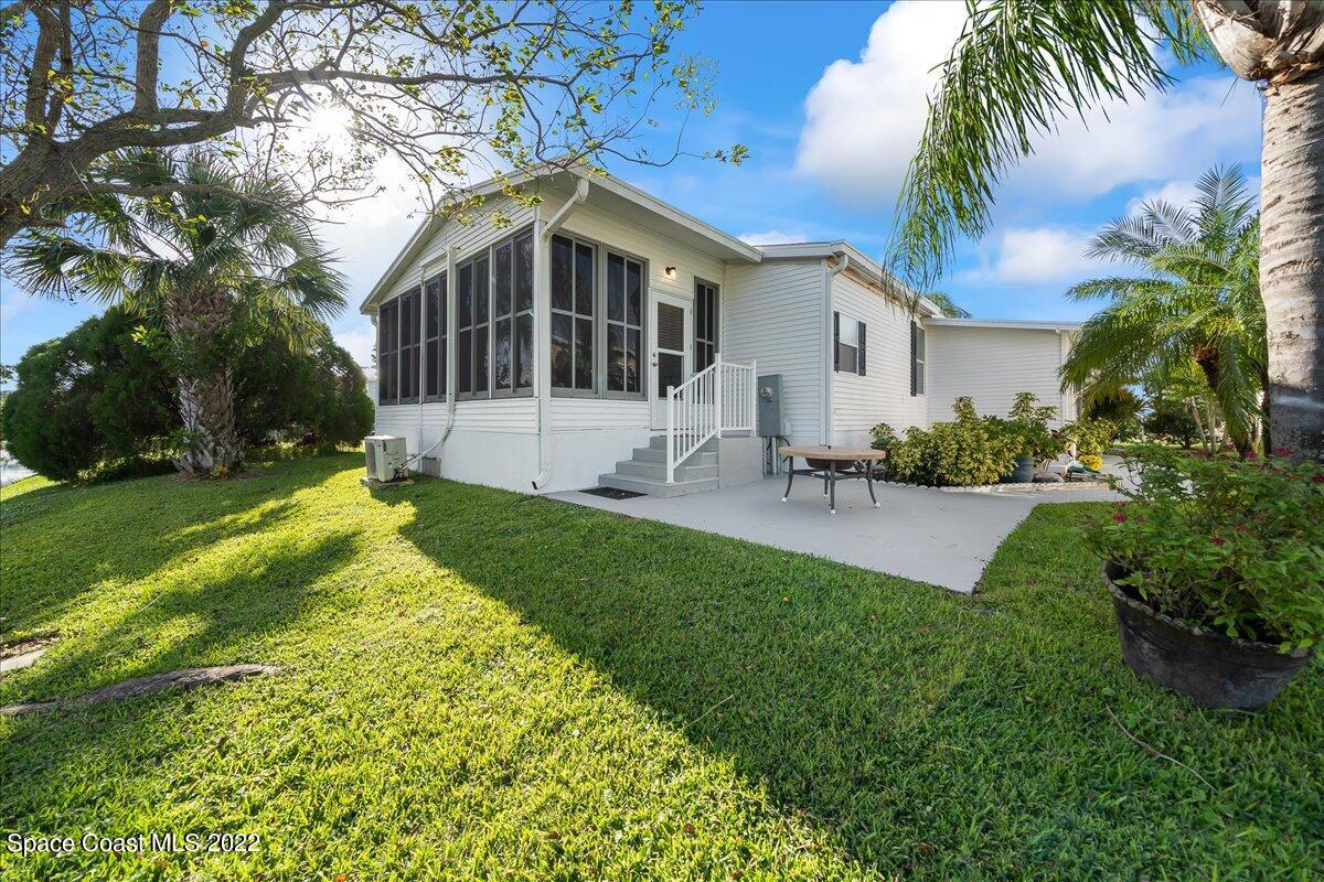 1017 Barefoot Circle Sebastian, FL 32976 - Photo 31 of 33 a front view of house with yard and green space