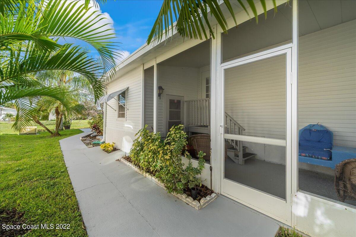 1017 Barefoot Circle Sebastian, FL 32976 - Photo 32 of 33 a front view of a house with a yard