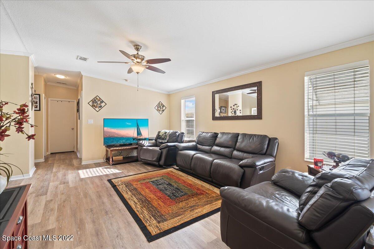 1017 Barefoot Circle Sebastian, FL 32976 - Photo 5 of 33 a living room with furniture and a flat screen tv