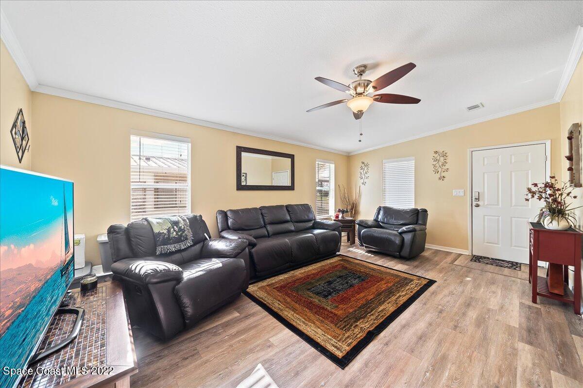 1017 Barefoot Circle Sebastian, FL 32976 - Photo 6 of 33 a living room with furniture rug and window