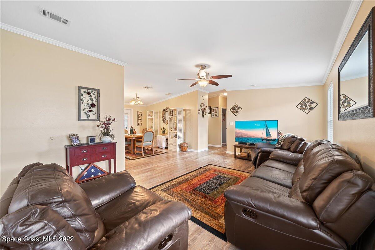 1017 Barefoot Circle Sebastian, FL 32976 - Photo 7 of 33 a living room with furniture and a flat screen tv