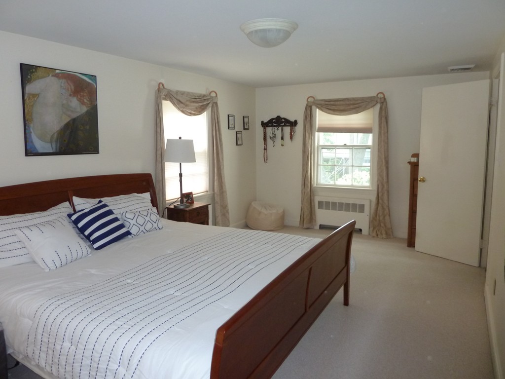 18 Glendale Road Marblehead, MA 01945 - Photo 21 of 29 a bedroom with a bed and a window