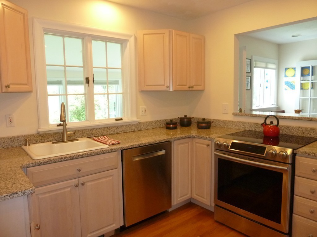 18 Glendale Road Marblehead, MA 01945 - Photo 10 of 29 a kitchen with a sink stove top oven and cabinets