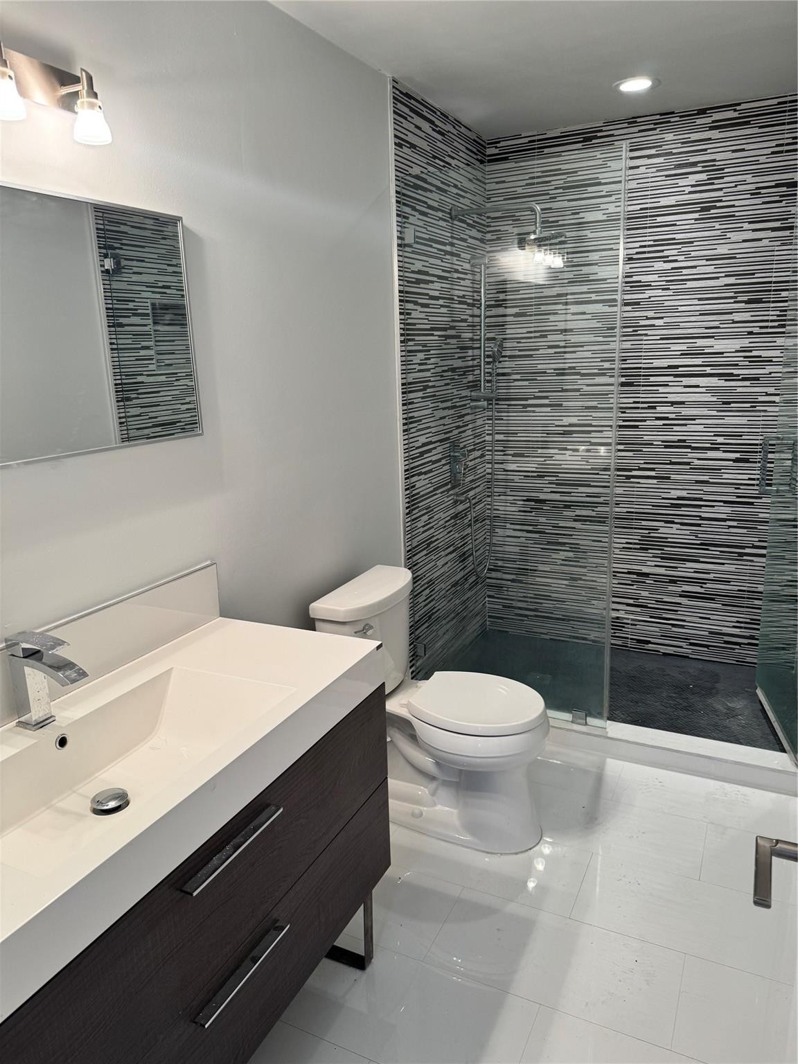8201 Northwest 198th Street Hialeah, FL 33015 - Photo 20 of 23 a bathroom with a sink a toilet and shower