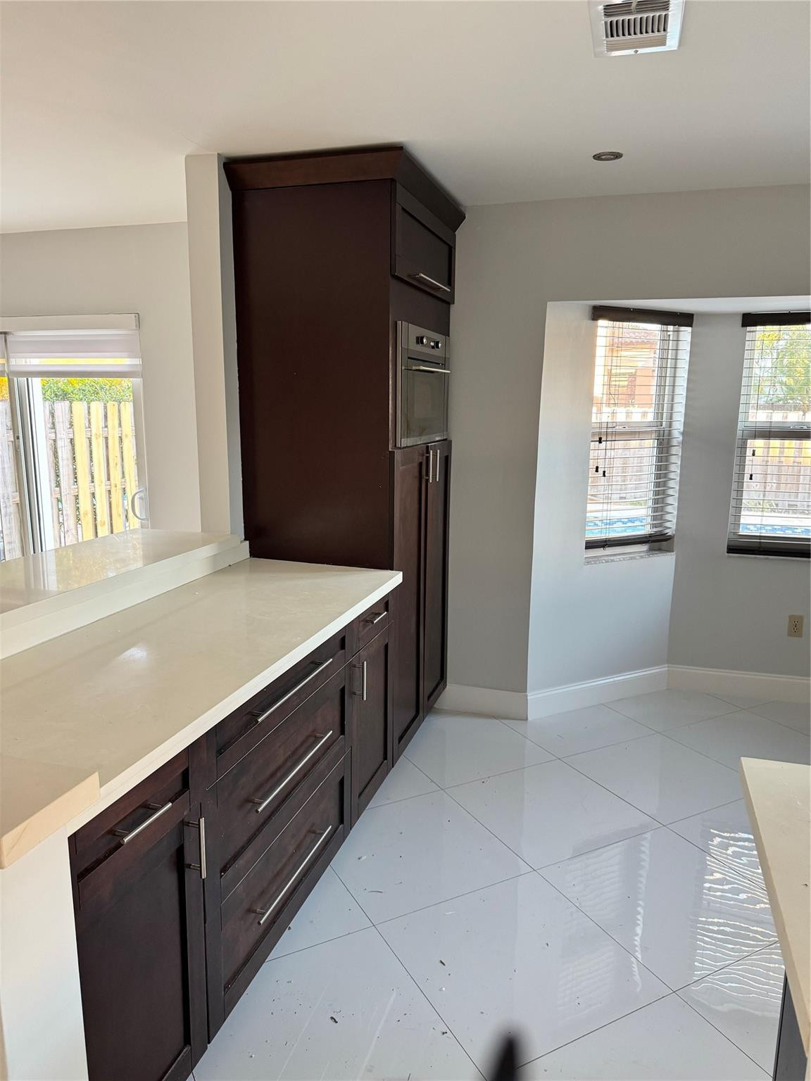 8201 Northwest 198th Street Hialeah, FL 33015 - Photo 7 of 23 a kitchen with a refrigerator and a sink