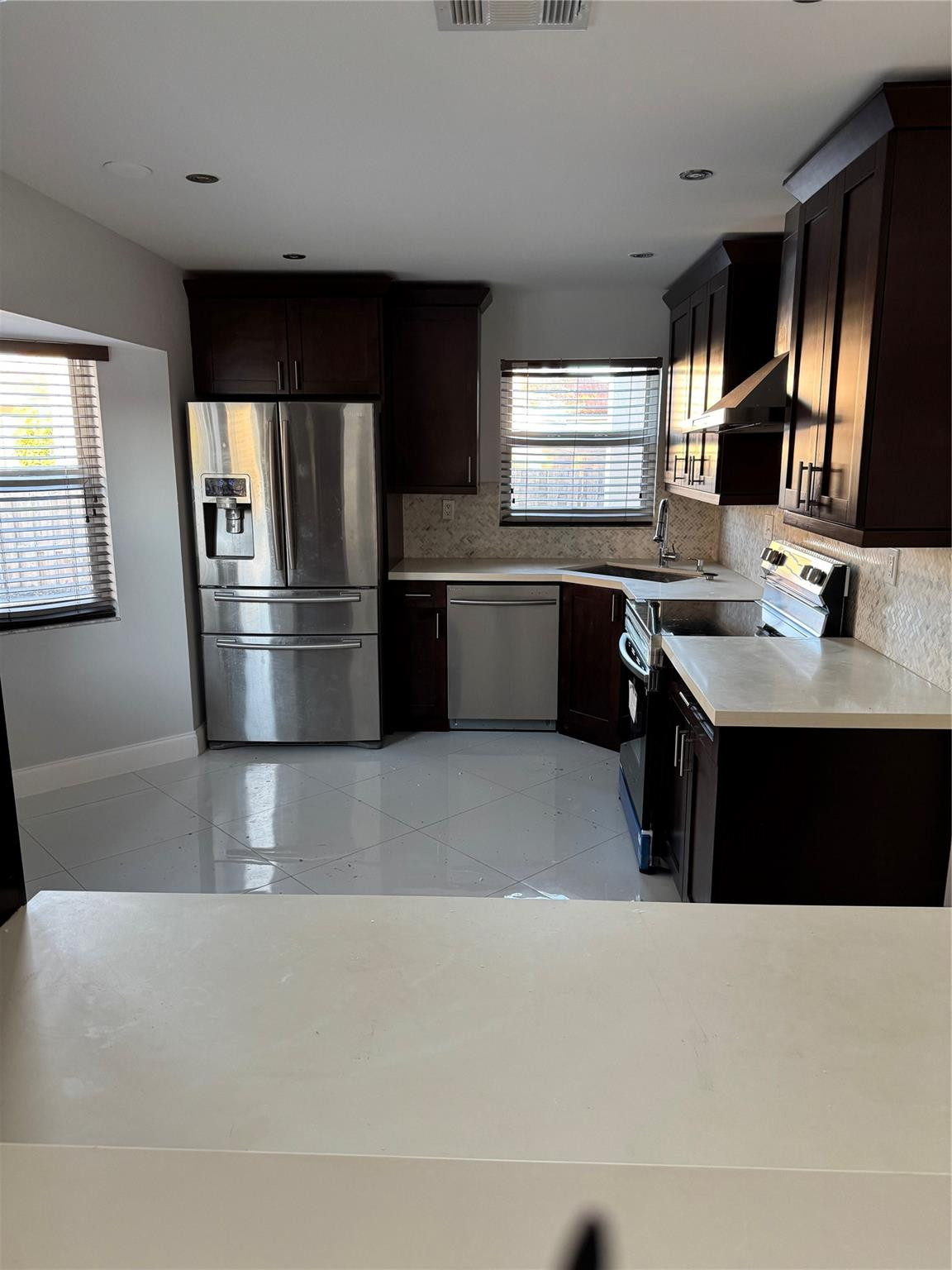 8201 Northwest 198th Street Hialeah, FL 33015 - Photo 8 of 23 a kitchen with a sink appliances and cabinets