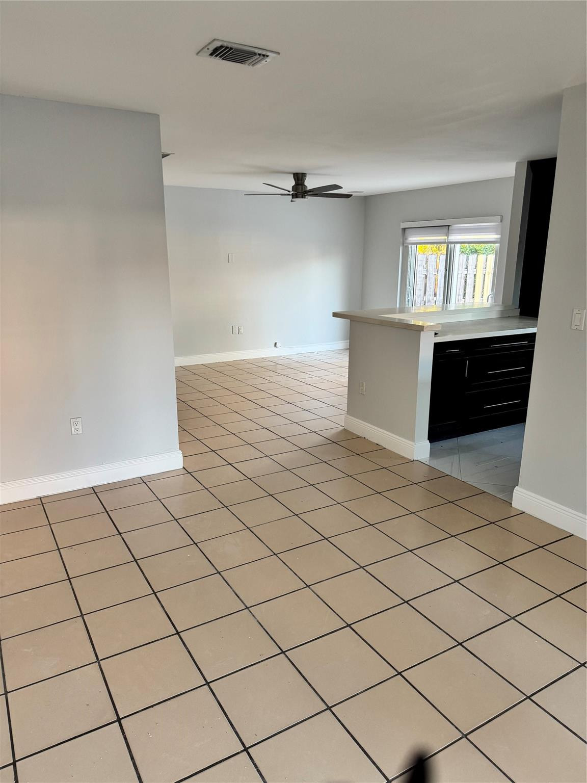 8201 Northwest 198th Street Hialeah, FL 33015 - Photo 10 of 23 a view of an empty room and window