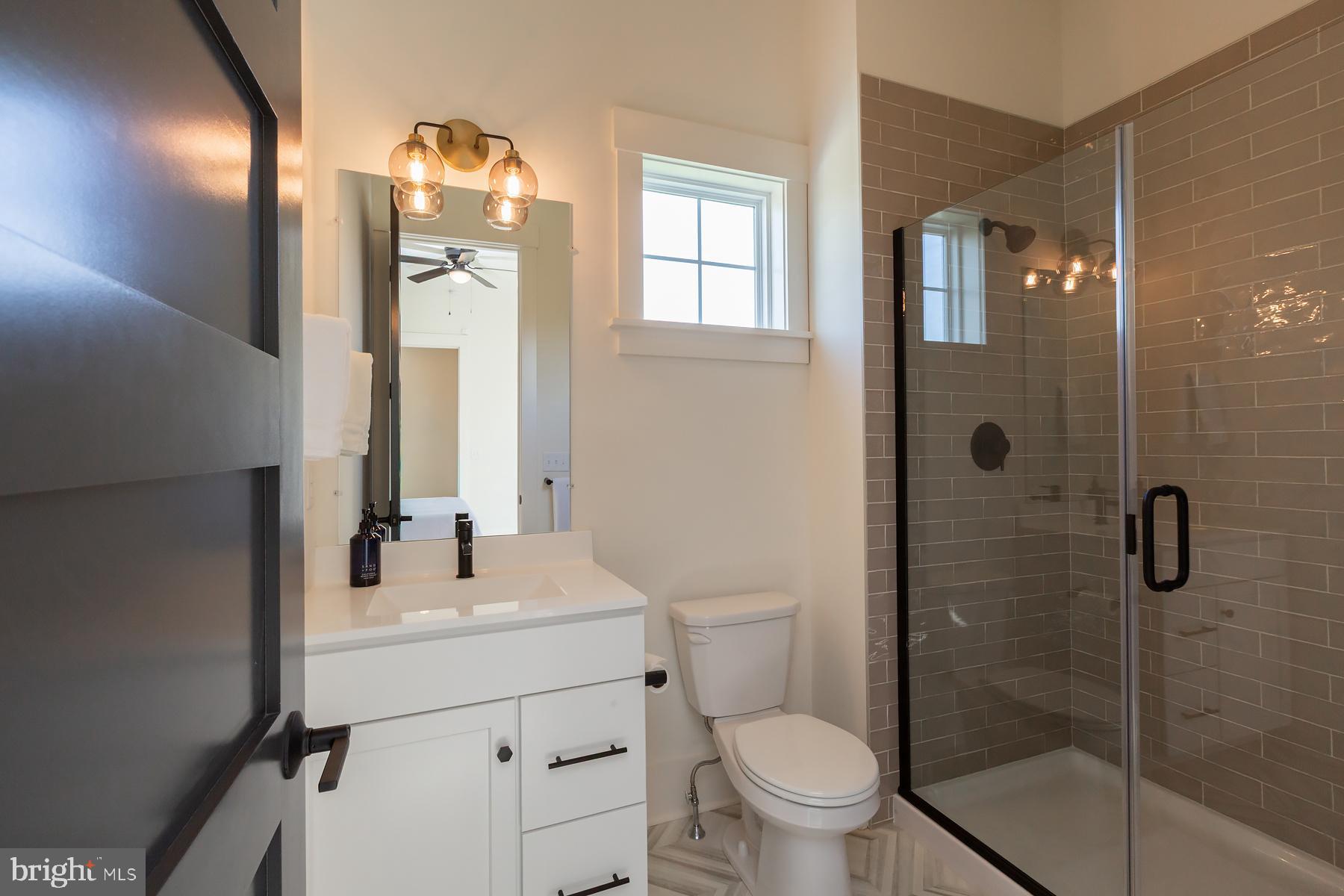 1016 Valley Crossing Drive Lititz, PA 17543 - Photo 37 of 85 a bathroom with a sink a toilet and shower