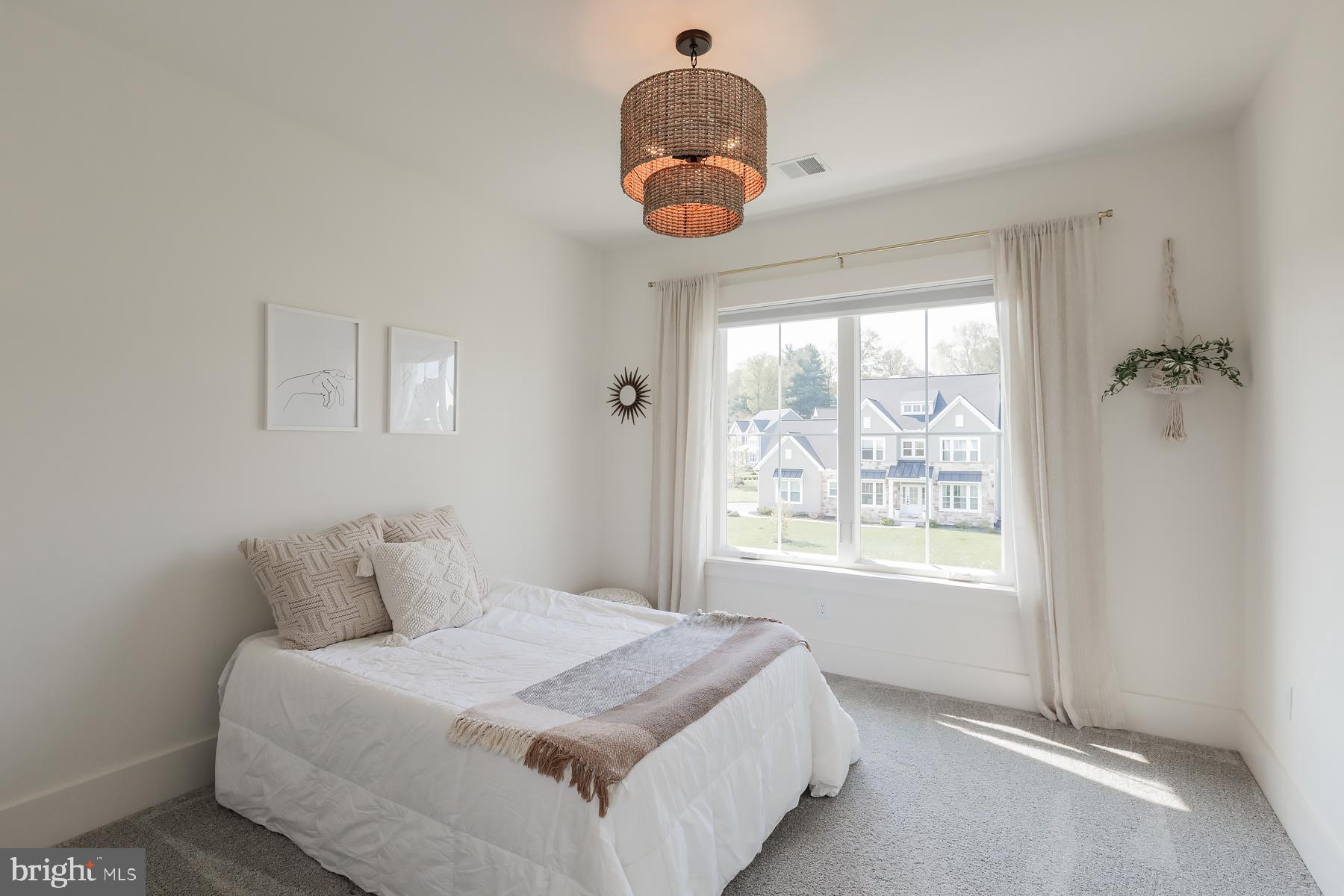 1016 Valley Crossing Drive Lititz, PA 17543 - Photo 60 of 85 a bedroom with a bed and a window