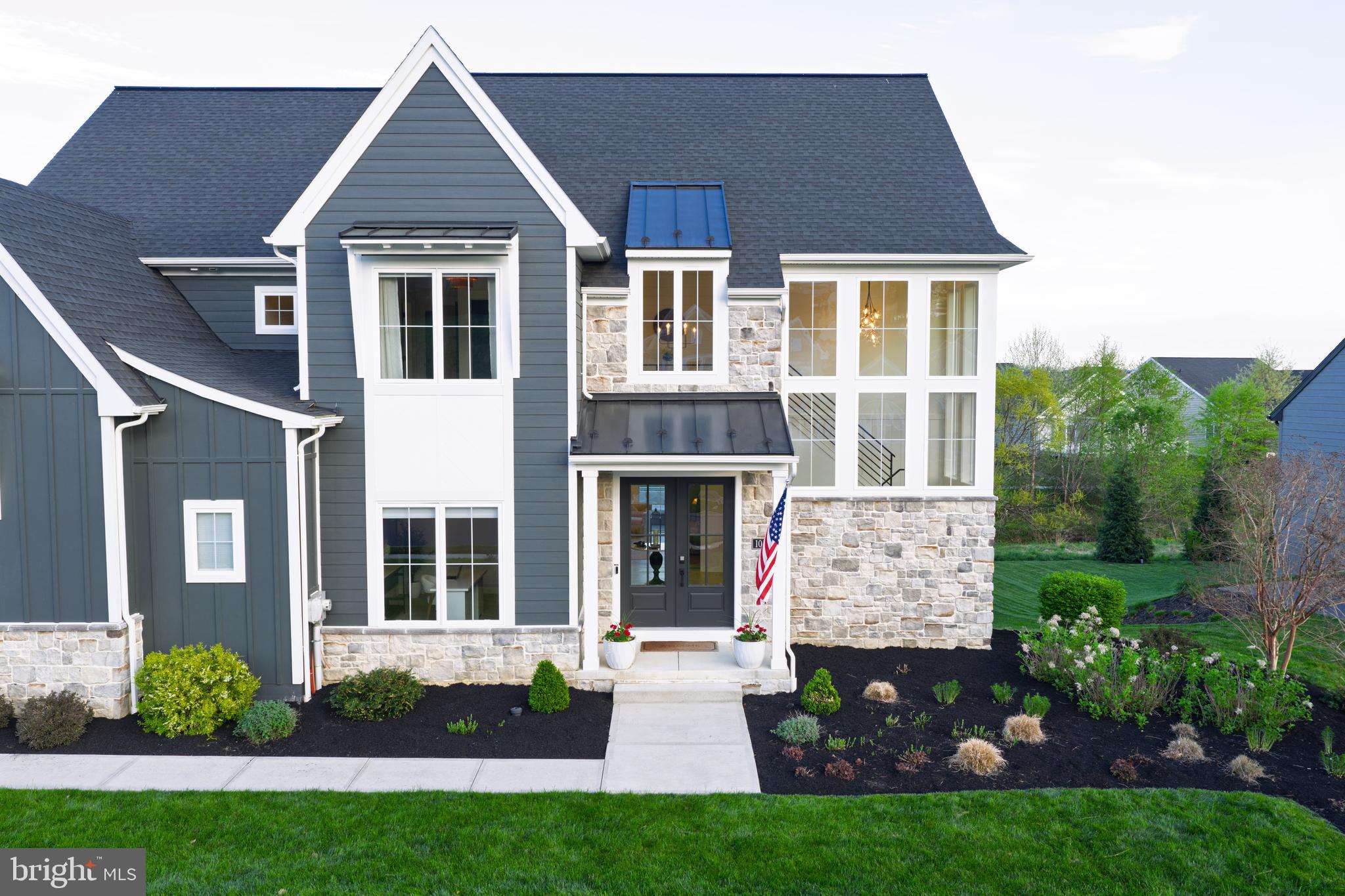 1016 Valley Crossing Drive Lititz, PA 17543 - Photo 74 of 85 a front view of a house with a garden and plants