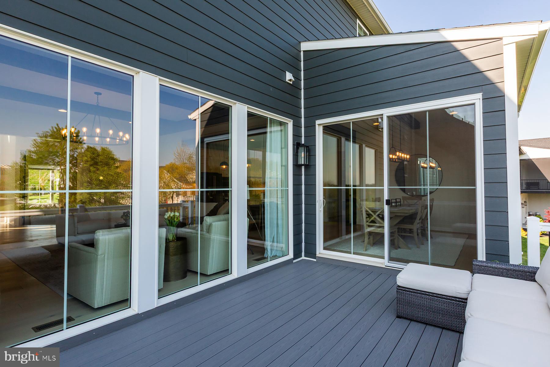 1016 Valley Crossing Drive Lititz, PA 17543 - Photo 78 of 85 a view of a balcony with floor to ceiling window with wooden floor
