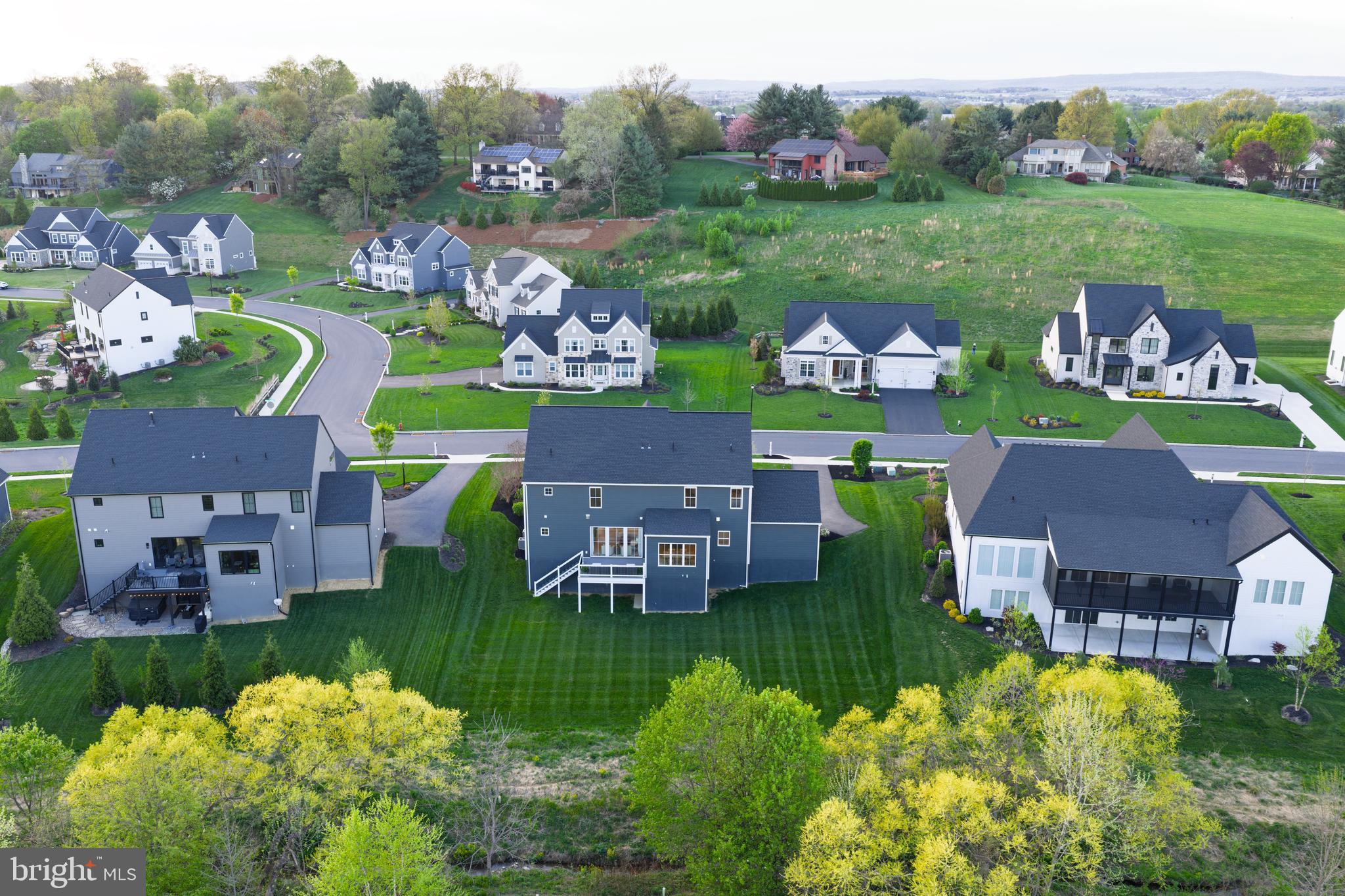 1016 Valley Crossing Drive Lititz, PA 17543 - Photo 82 of 85 an aerial view of multiple house with a garden