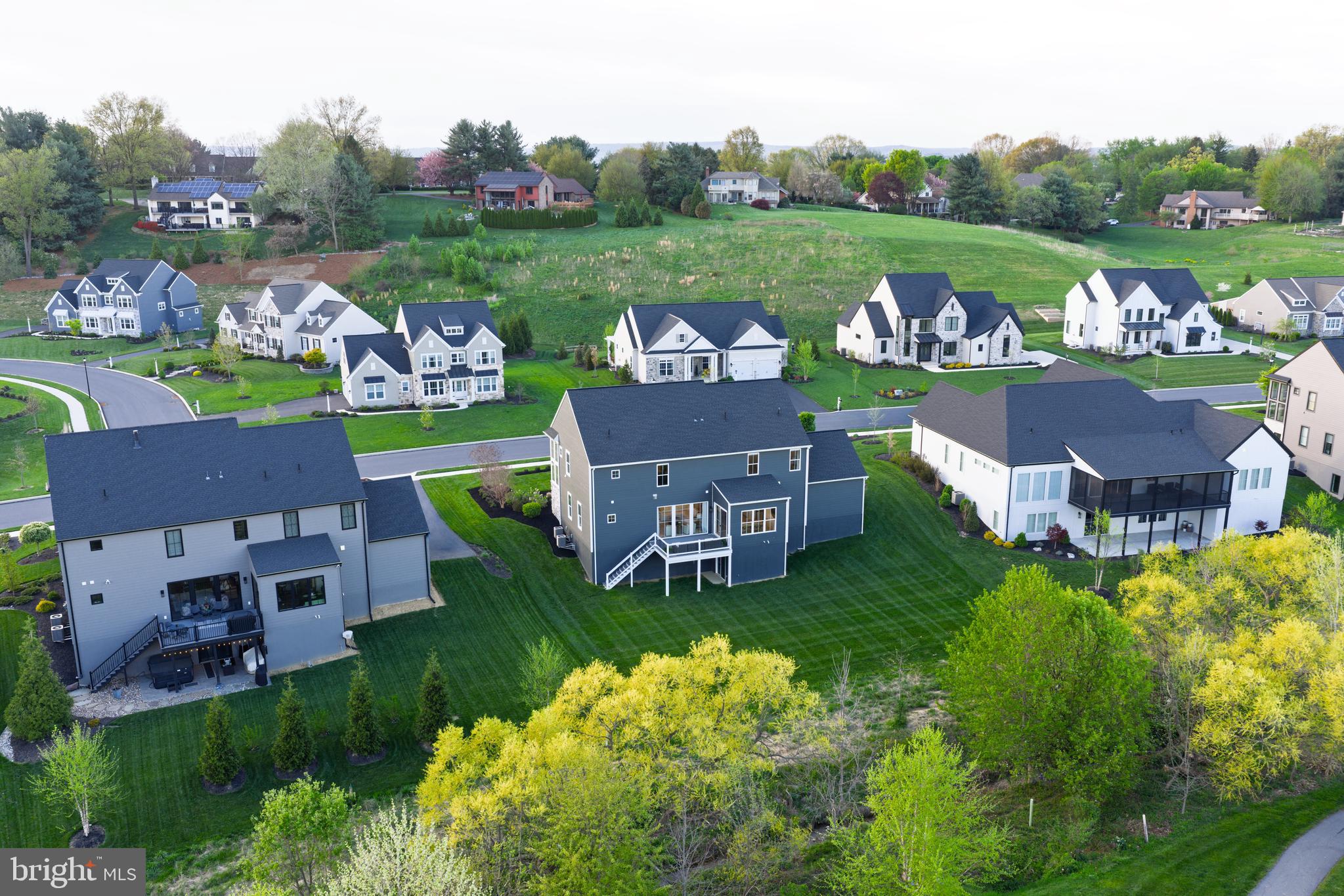 1016 Valley Crossing Drive Lititz, PA 17543 - Photo 83 of 85 an aerial view of a house with a garden and trees
