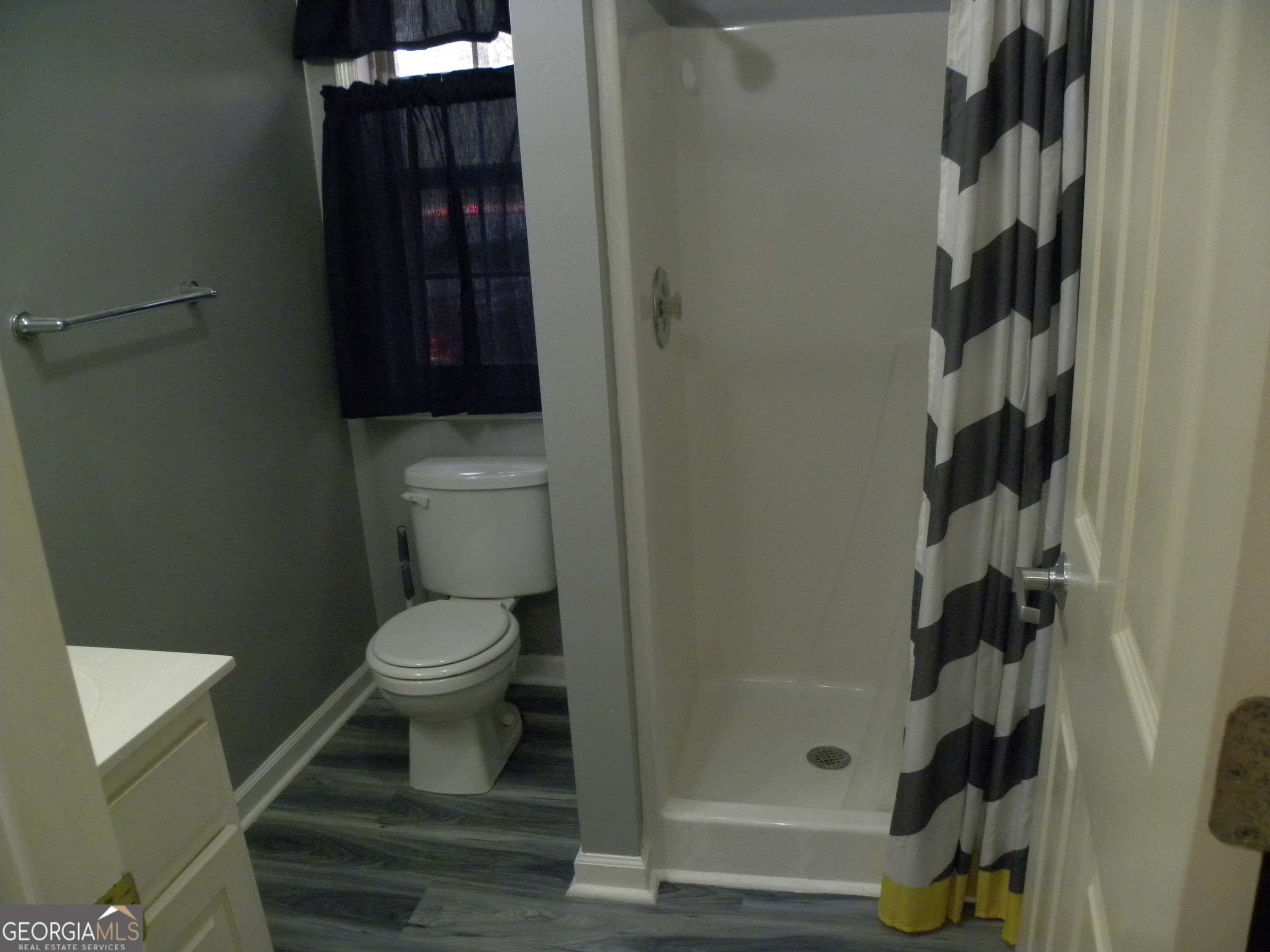 101 And 103 Joy Lane, Unit DUPLEX Hartwell, GA 30643 - Photo 23 of 24 a bathroom with a toilet and a shower