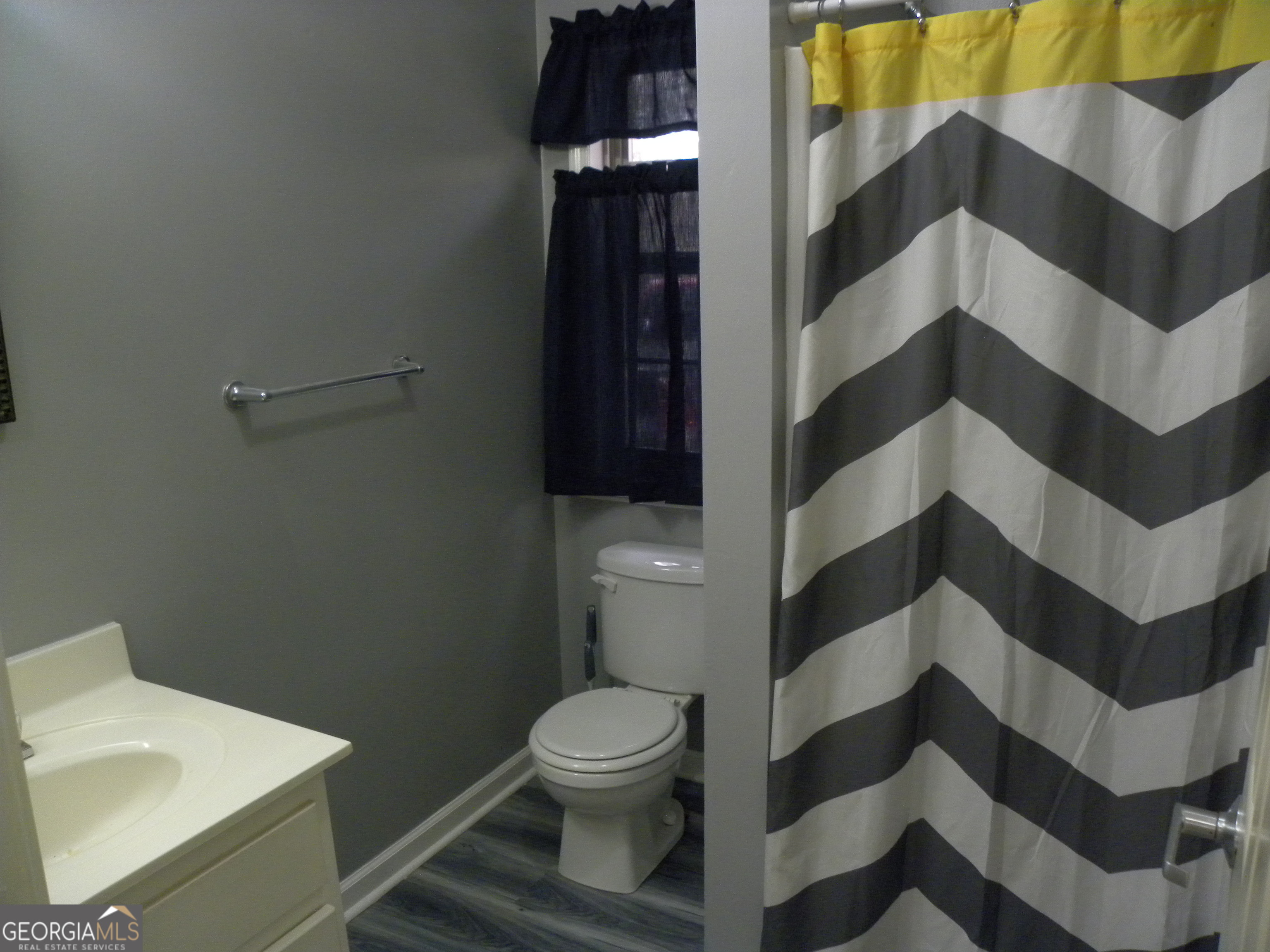 101 And 103 Joy Lane, Unit DUPLEX Hartwell, GA 30643 - Photo 24 of 24 a bathroom with a sink and mirror