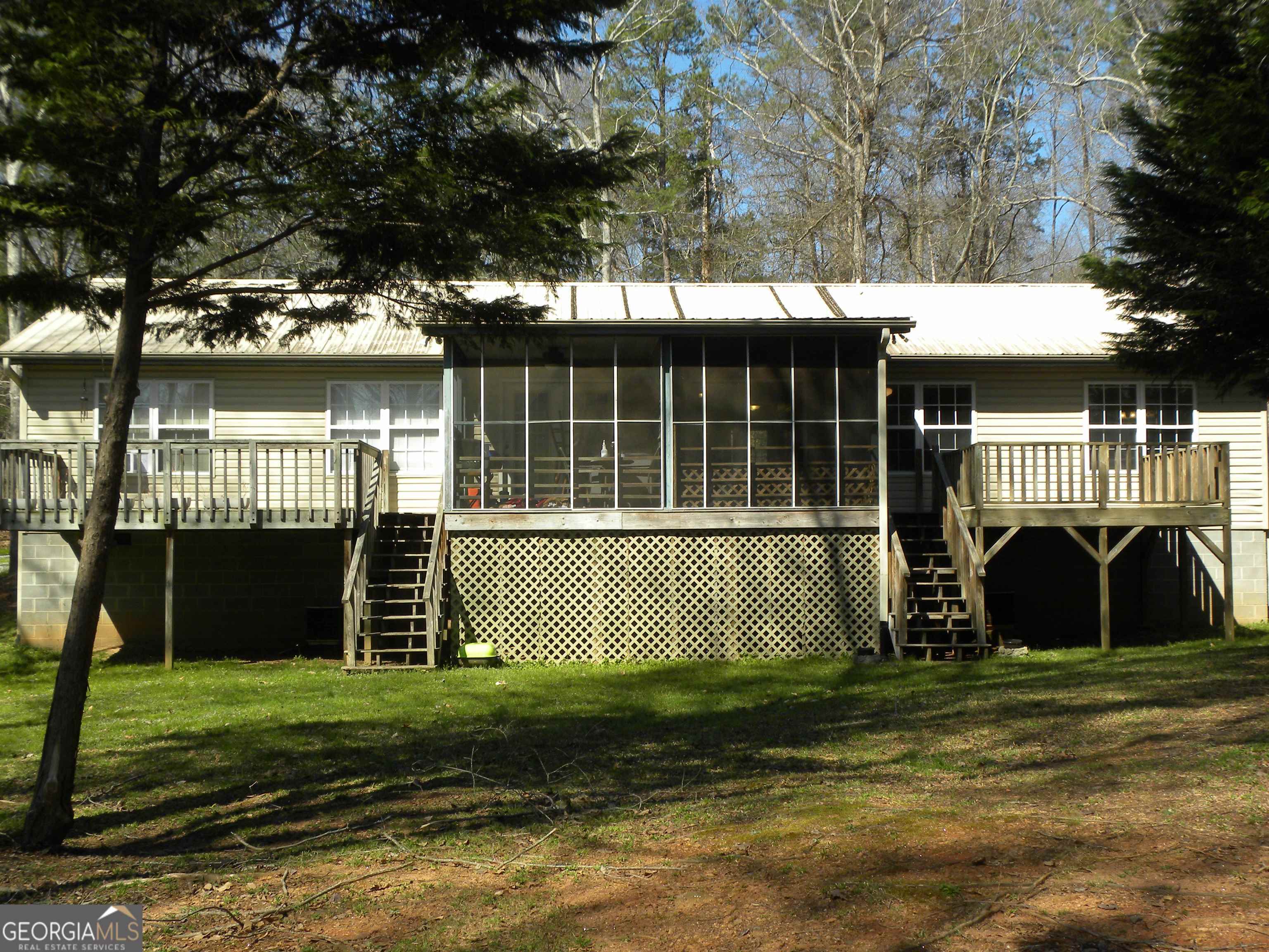 101 And 103 Joy Lane, Unit DUPLEX Hartwell, GA 30643 - Photo 8 of 24 a view of a house with a yard and a large tree