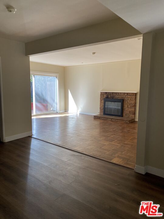 16464 Sunset Boulevard Pacific Palisades, CA 90272 - Photo 2 of 13 a view of a room with wooden floor