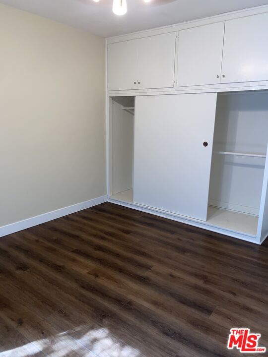 16464 Sunset Boulevard Pacific Palisades, CA 90272 - Photo 5 of 13 a view of an empty room with wooden floor