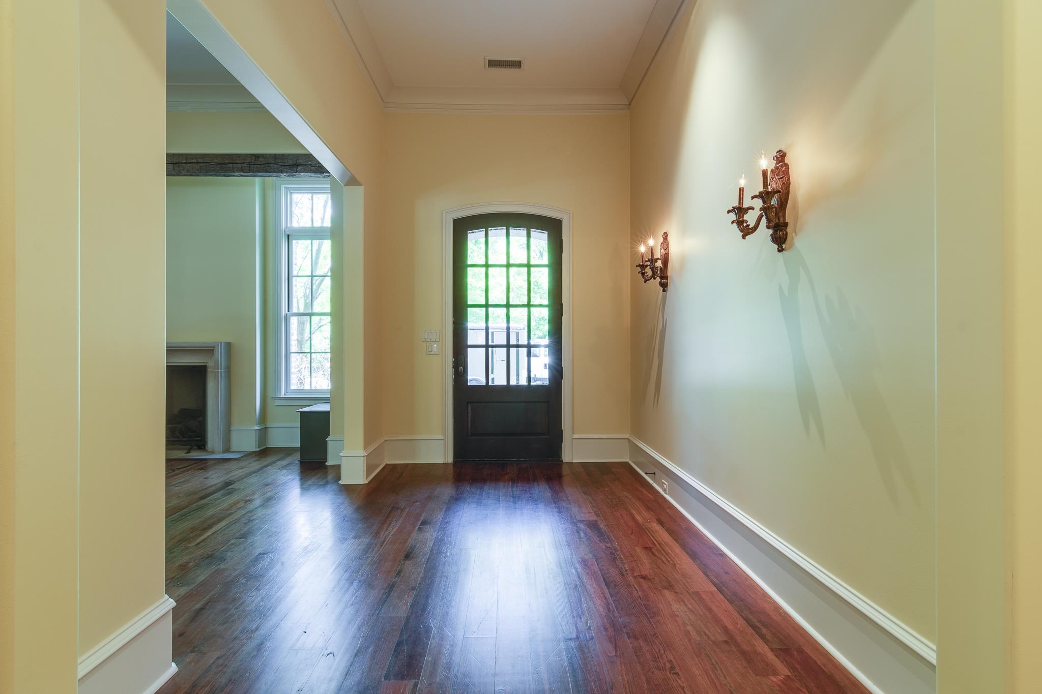 4761 Shady Grove Road Memphis, TN 38117 - Photo 3 of 25 an empty room with wooden floor and windows