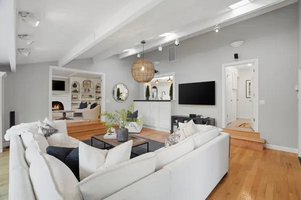 a view of a livingroom with furniture and wooden floor