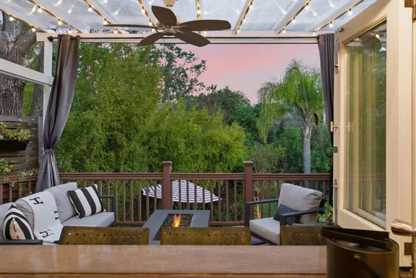 an aerial view of a house with a yard and garden
