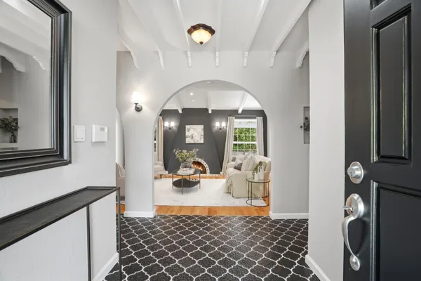 a picture of a bathroom with mirror and shower
