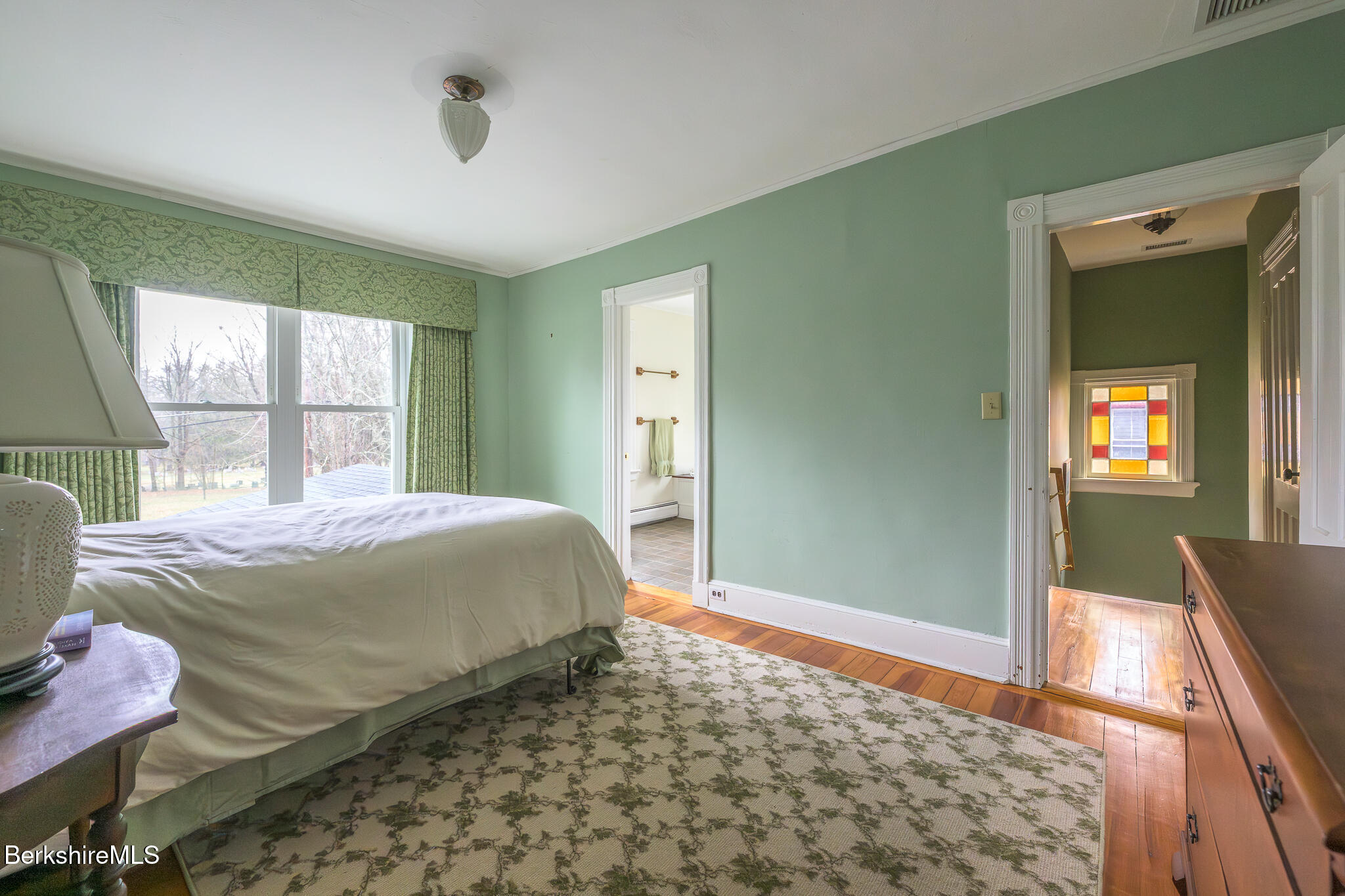 11 Sergeant Street Stockbridge, MA 01262 - Photo 29 of 52 a bedroom with a bed and wooden floor