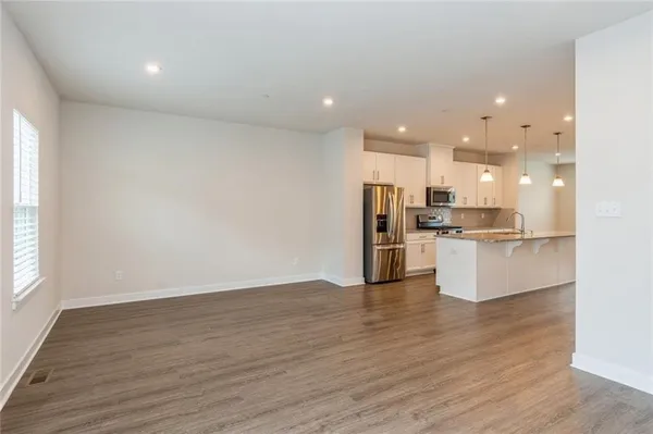 a view of kitchen with wooden floor