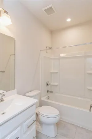 a bathroom with a sink a toilet and a bathtub
