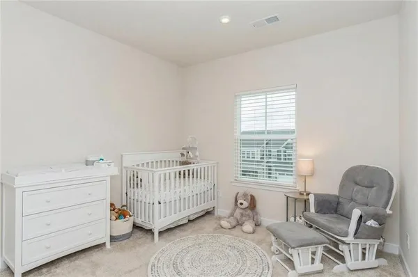 a bedroom with furniture and a window