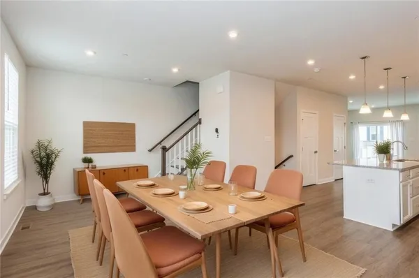 a dining room with a table and chairs