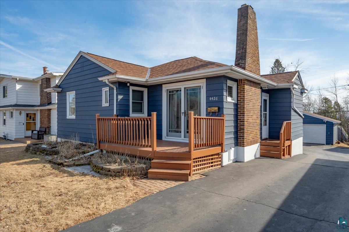 4426 Dodge Street Duluth, MN 55804 - Photo 1 of 27 Bungalow with an outbuilding, a chimney, and a shingled roof