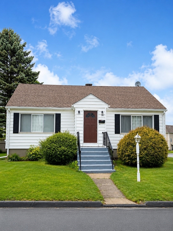 31 Ancona Road Worcester, MA 01604 - Photo 2 of 3 a front view of a house with a garden