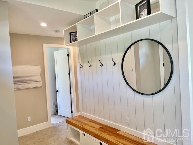 13 Emerald Road Kendall Park, NJ 08824 - Photo 2 of 24 an entryway with wooden floor and a mirror