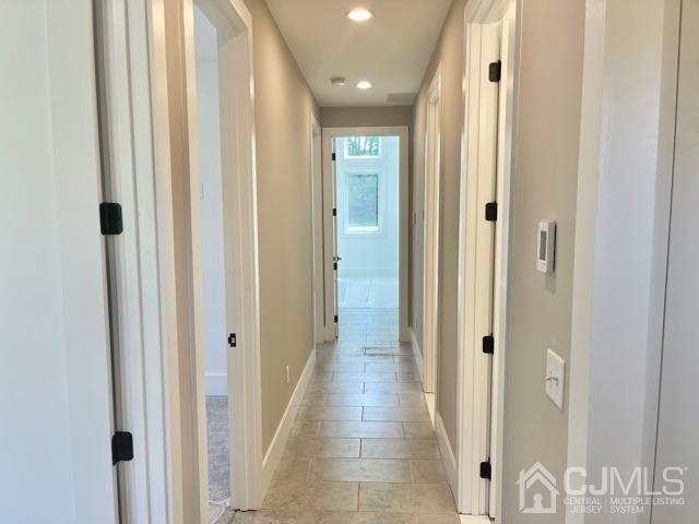13 Emerald Road Kendall Park, NJ 08824 - Photo 12 of 24 a view of a hallway with wooden floor and a glass door